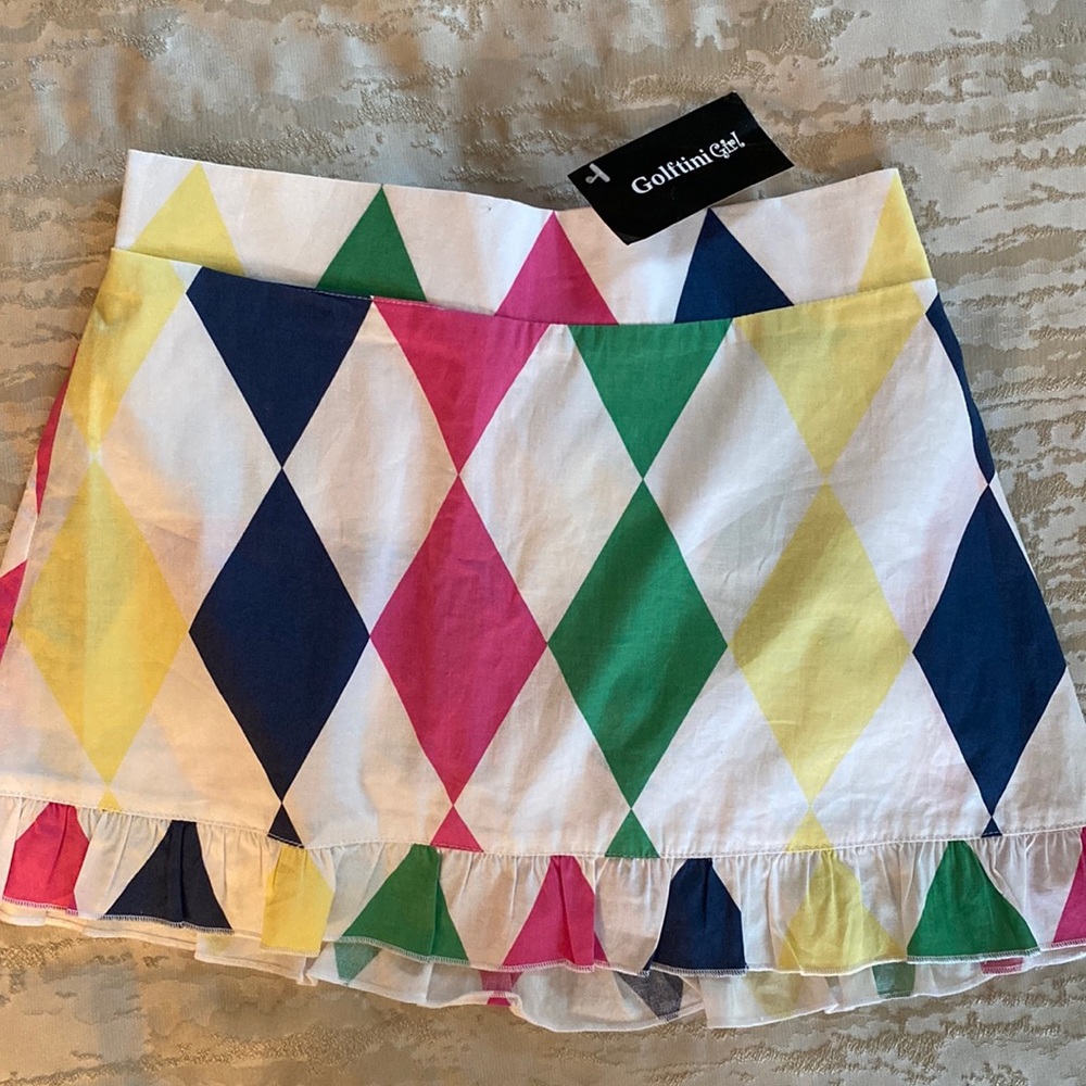 Golf / tennis skort. Incl. built in shorts.  Perfect condition. Girls size L